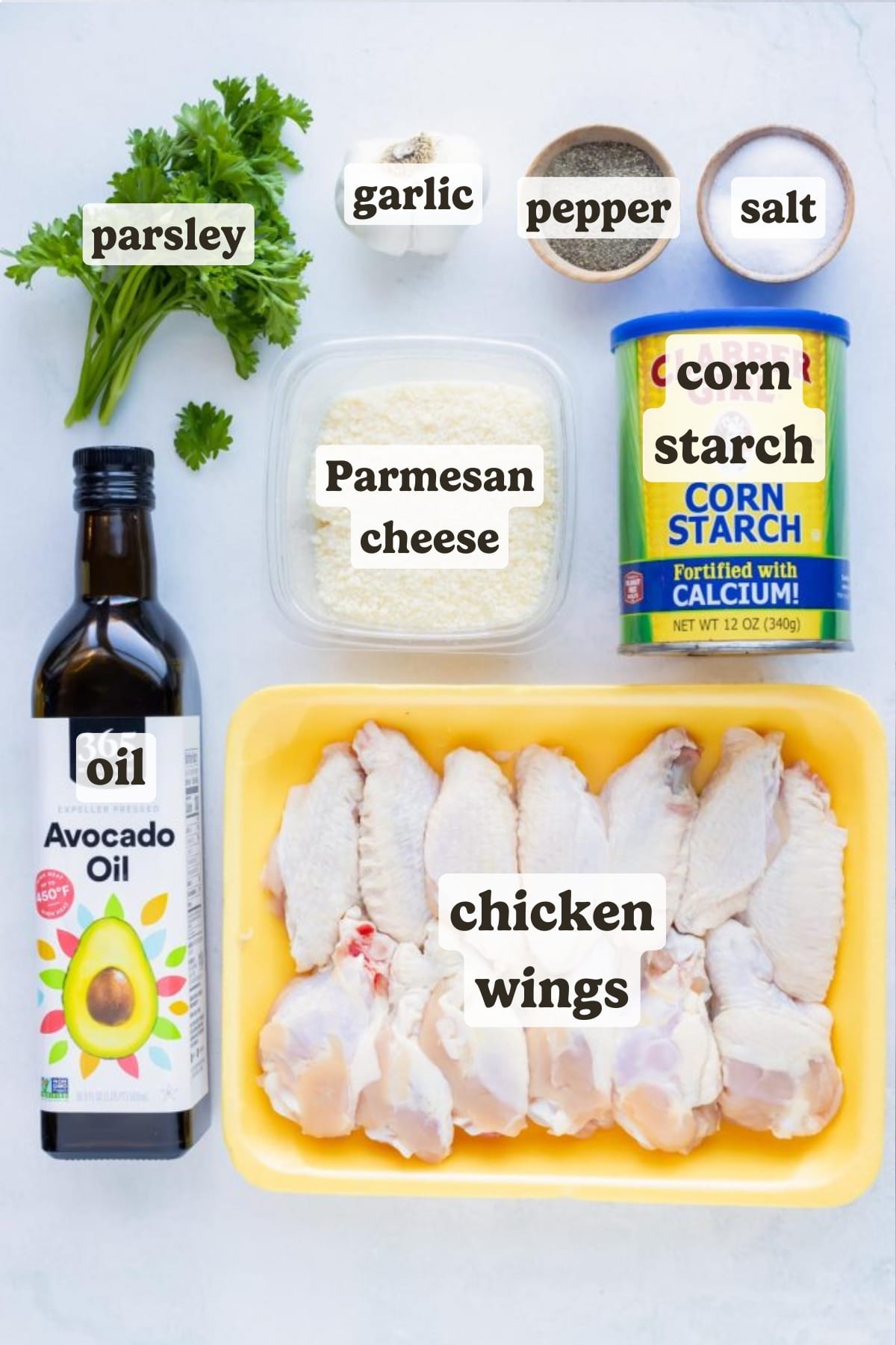 Chicken wings, oil, corn starch, salt, pepper, garlic, and parmesan are the ingredients in this recipe.