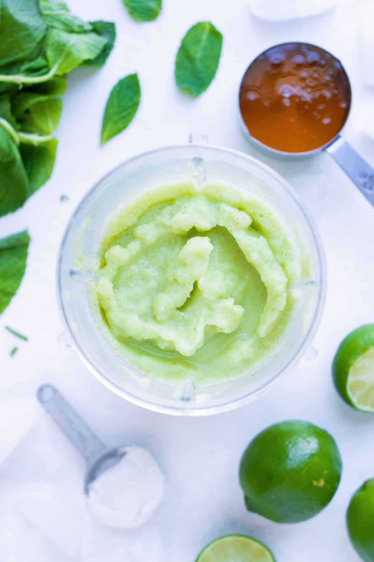 Mojito ingredients are blended together until smooth