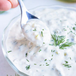 Tartar sauce recipe is served with a spoon for serving with fries or crab cakes.
