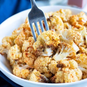 Low-carb air fryer cauliflower is eaten with a fork.