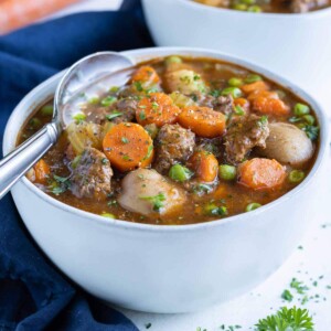 Bowls of pressure cooker stew are shown on the counter.