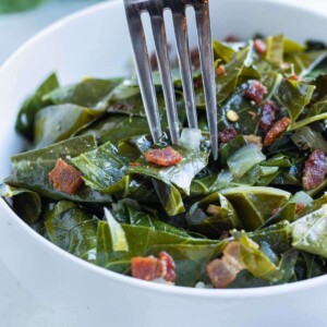 A fork is used to enjoy low-carb collard greens.