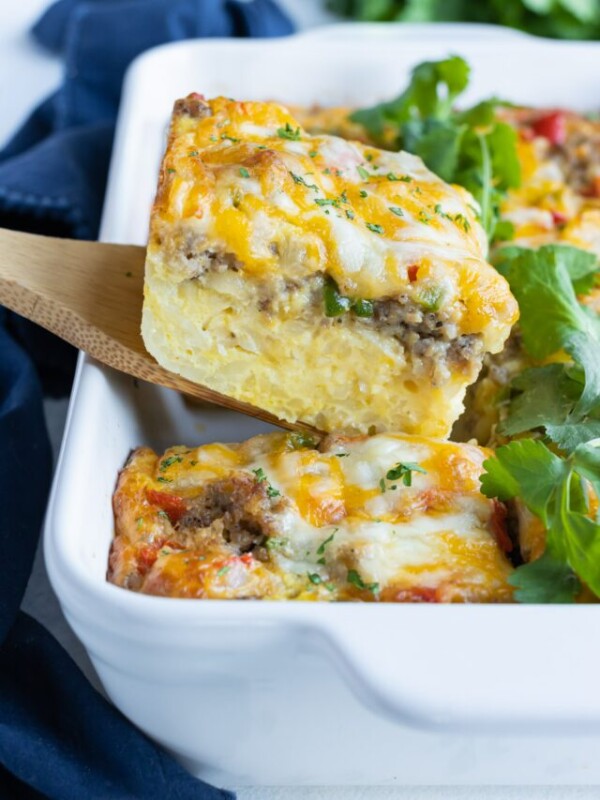 Sausage breakfast casserole is served with a spatula.