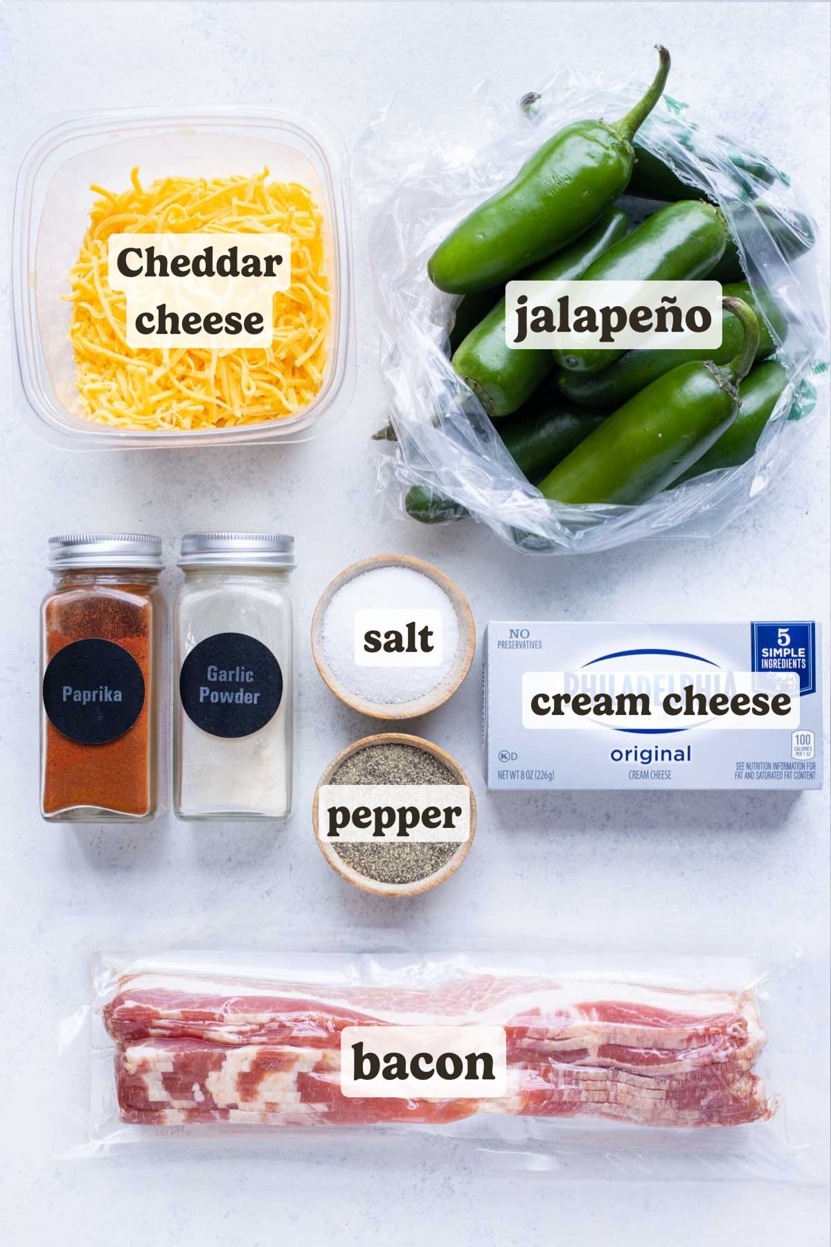 Jalapenos, cheddar cheese, bacon, cream cheese, and seasonings are the ingredients for this recipe.