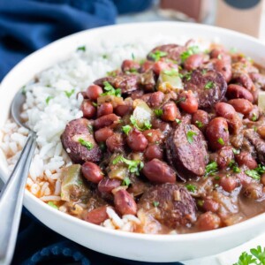 Instant pot red beans and sausage are served with white rice.