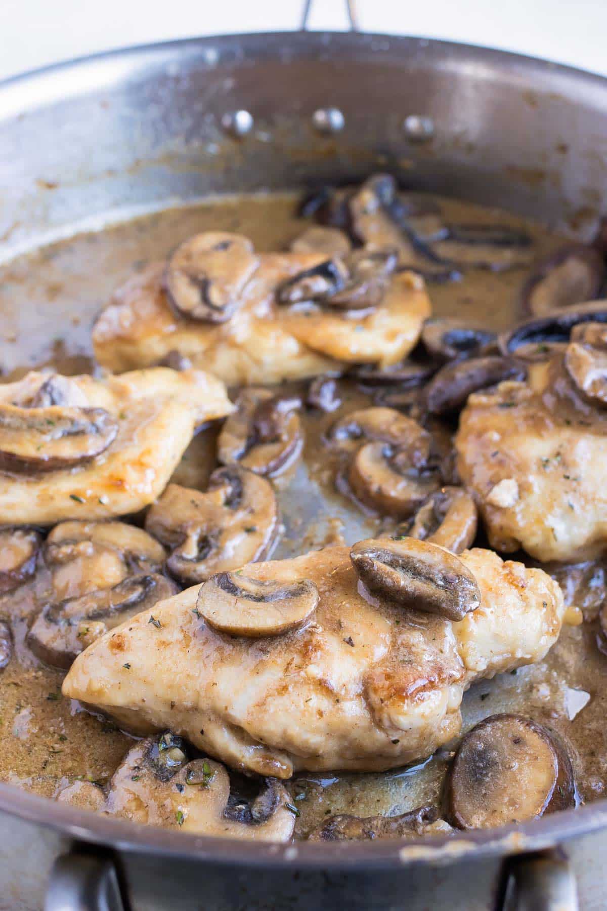 Chicken is added back to the pan.