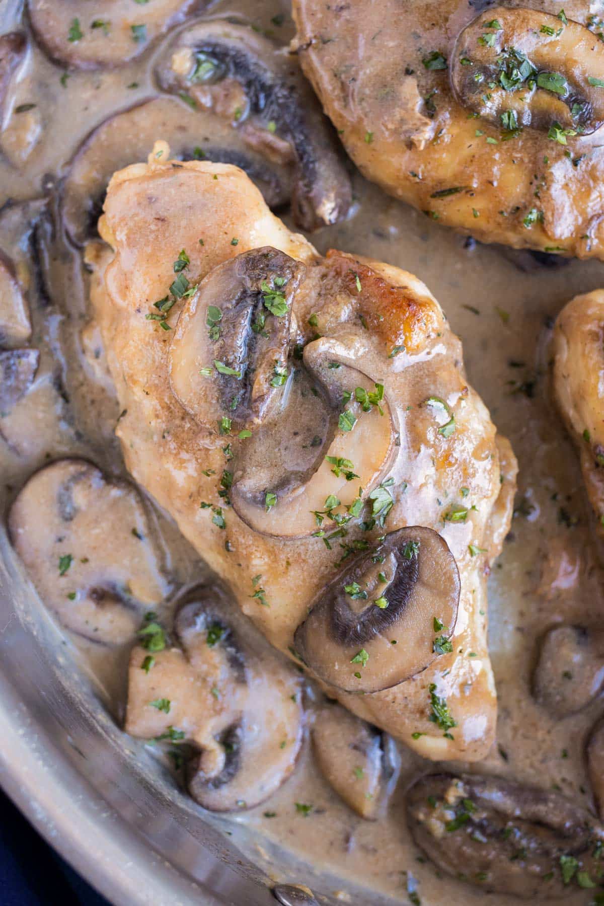 A crispy chicken breast is covered in the creamy Marsala sauce in this irresistible Olive Garden Chicken Marsala.