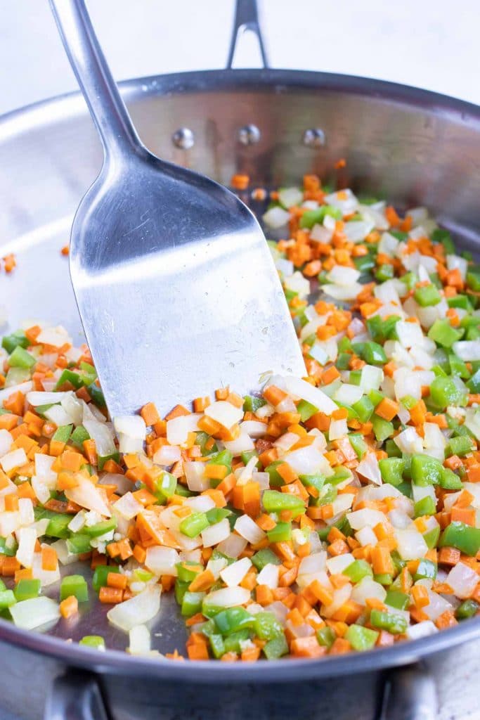 Diced vegetables are cooked in the skillet first.