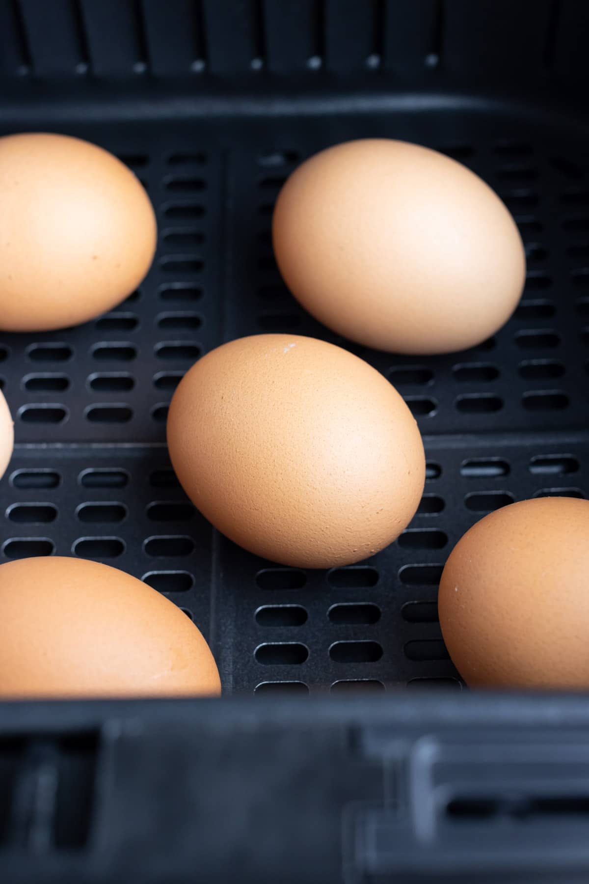 Eggs are cooked hard-boiled style in the air fryer.