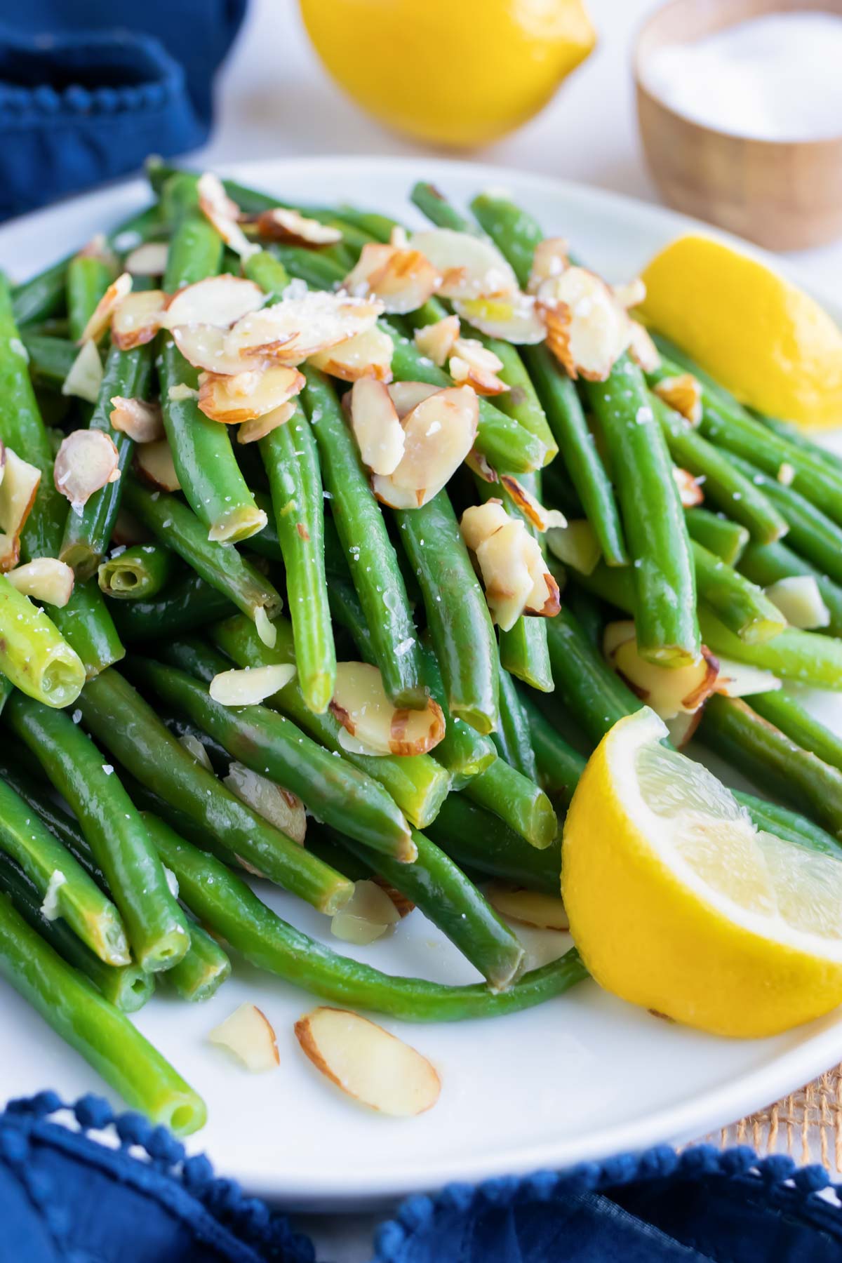 An easy green beans amandine side dish recipe with slivered almonds and fresh lemon juice.