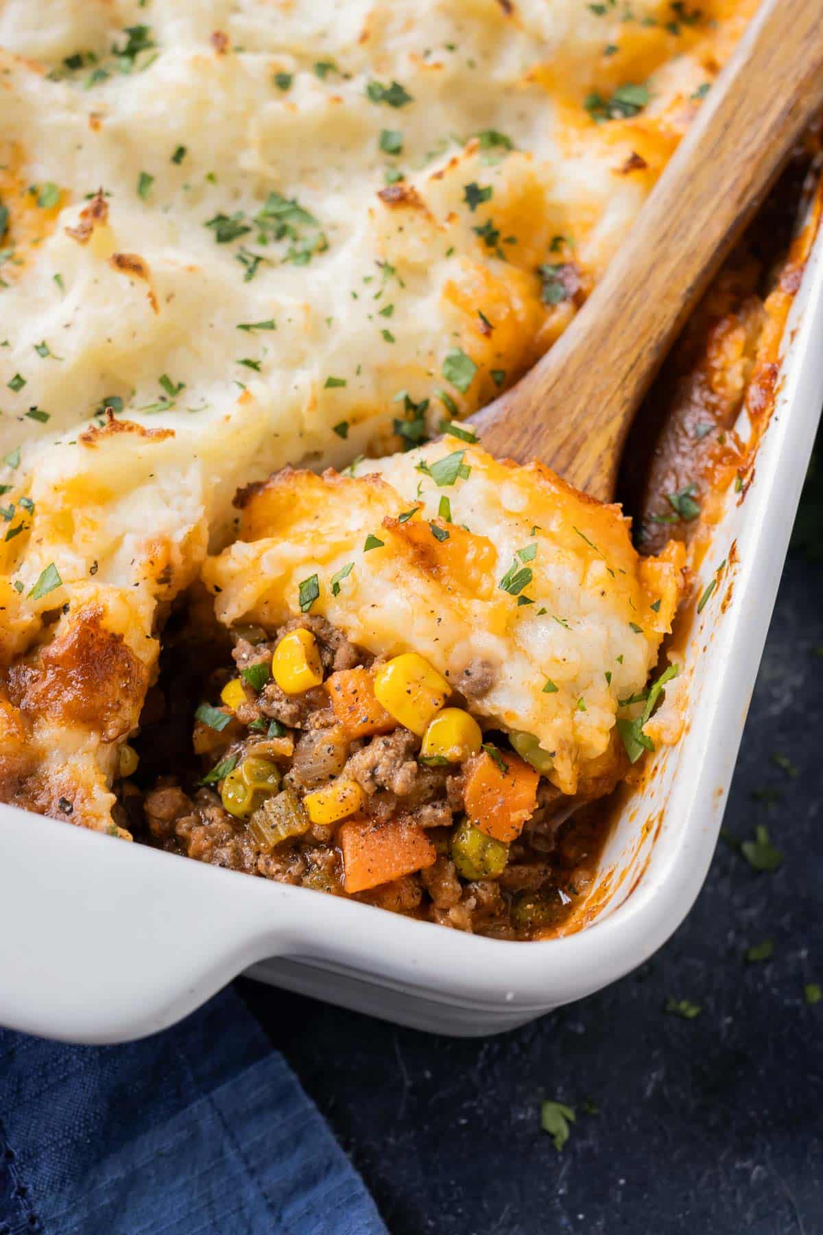 Shepherds Pie with golden mashed potatoes is baked in a casserole dish.