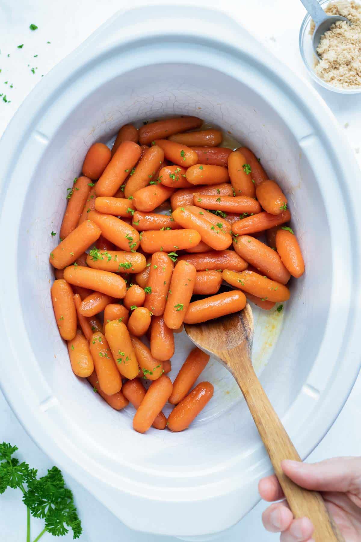 https://www.evolvingtable.com/wp-content/uploads/2022/10/Slow-Cooker-Glazed-Carrots-5.jpg