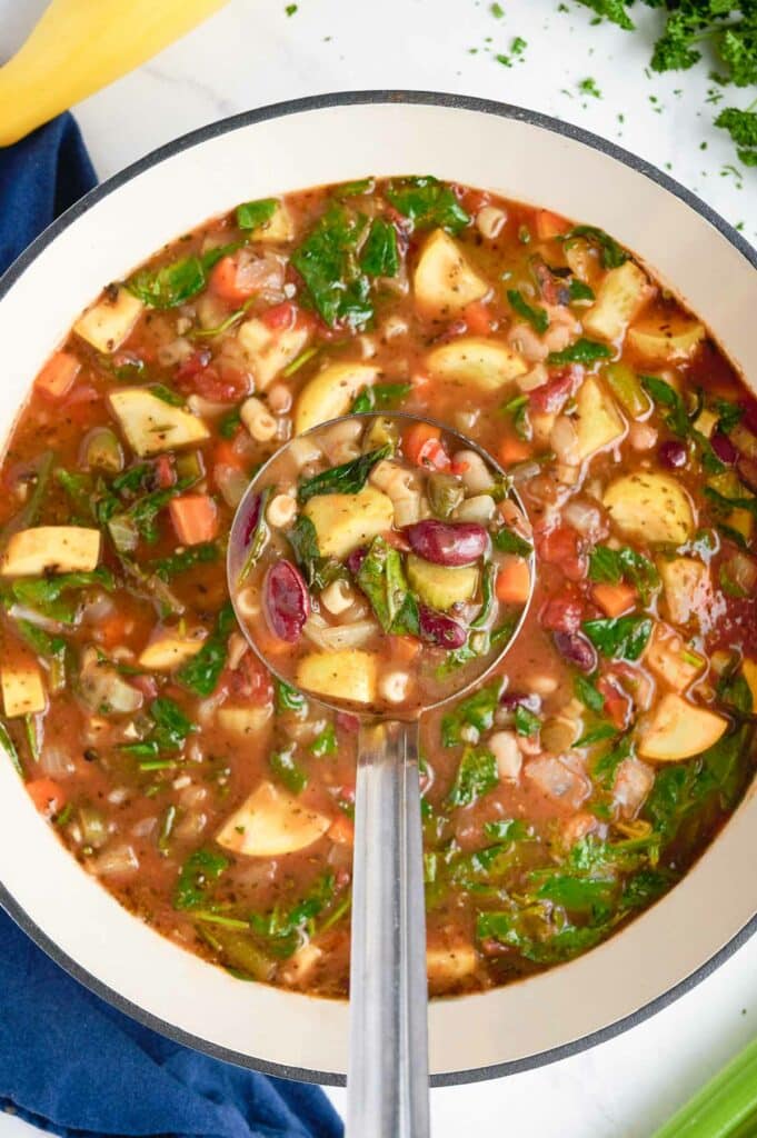 An overhead shot of minestrone soup.