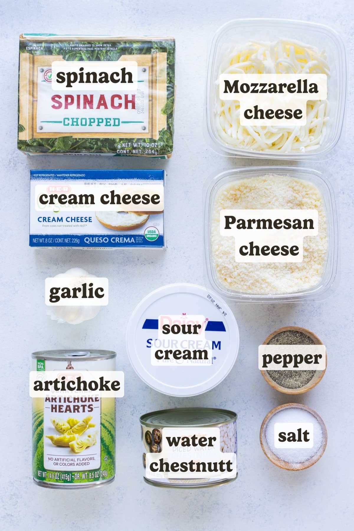 Cream cheese, sour cream, parmesan cheese, mozzarella, garlic, salt, pepper, spinach, and artichoke hearts are the ingredients fro this recipe.