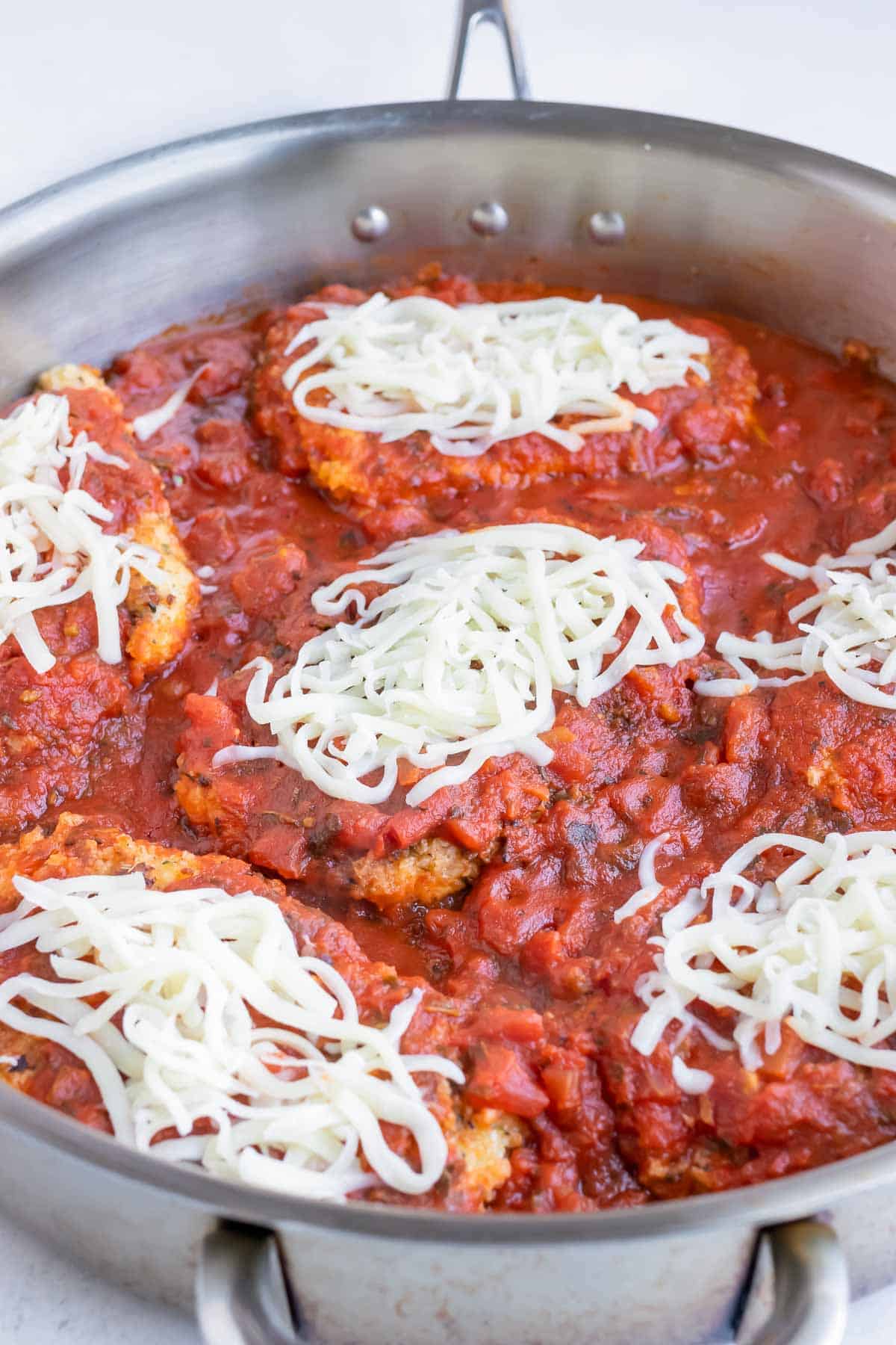 Top the chicken parmesan with mozzarella cheese for this easy meal.