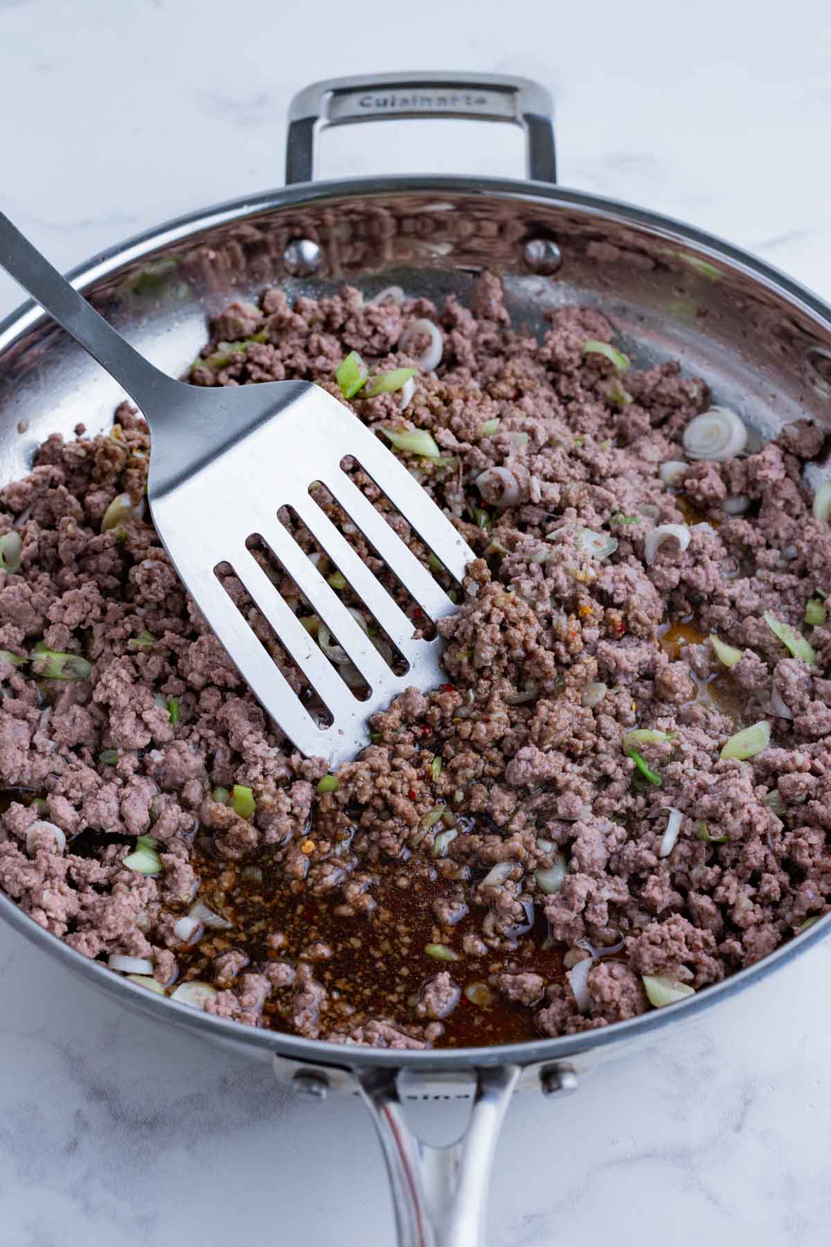 The sauce ingredients are added to the beef mixture.