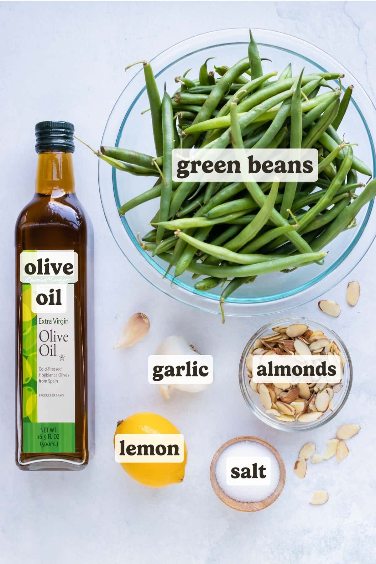 Oil, butter, garlic, lemon, sliced almonds, and fresh green beans.