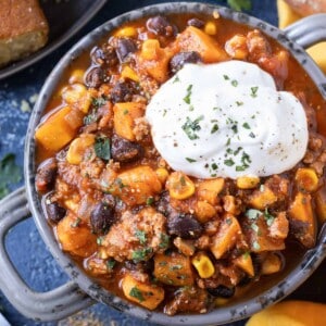 Sweet potato turkey chili is served in a bowl with sour cream.