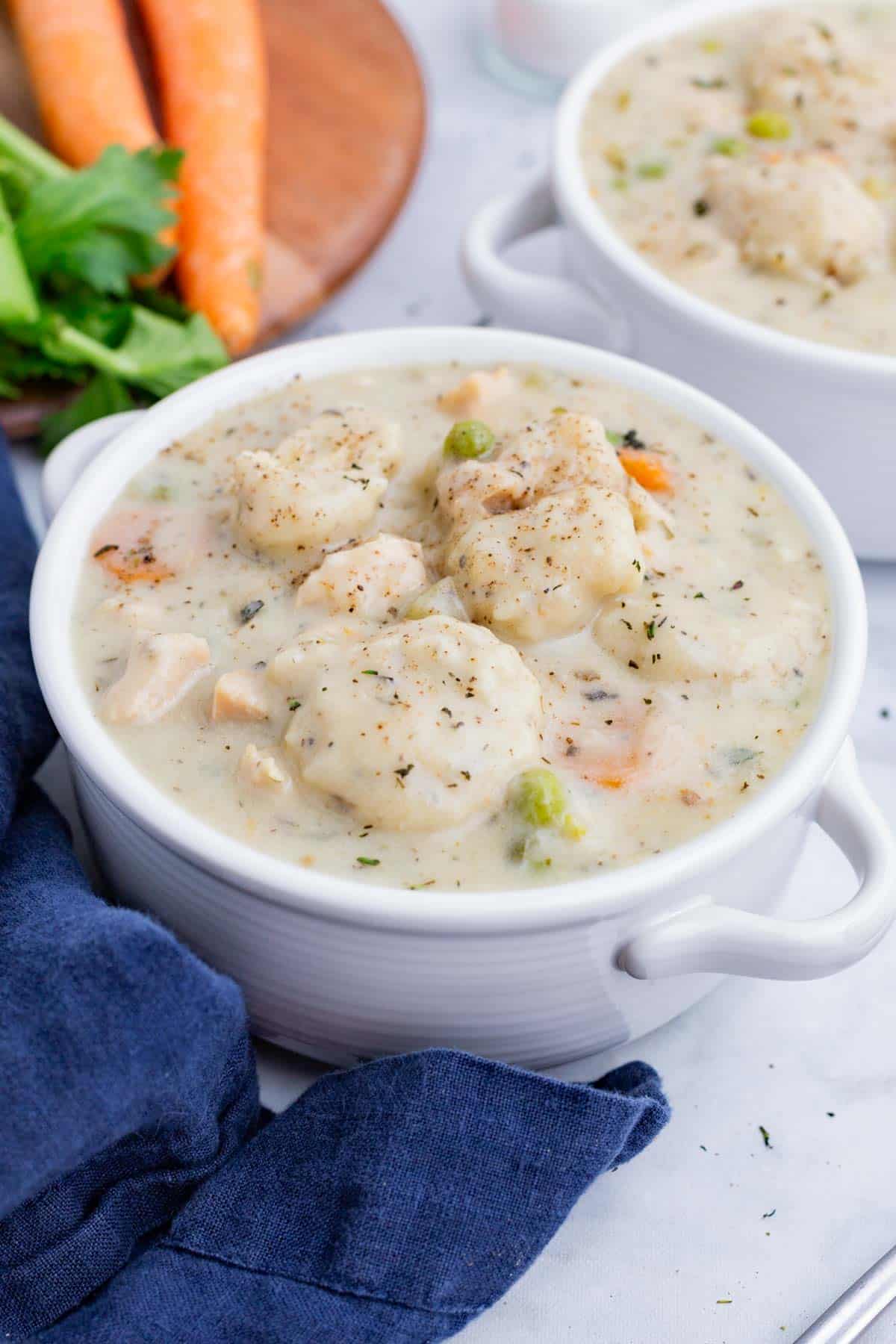 Two bowls of chicken dumpling soup are served for a warm, Fall lunch.