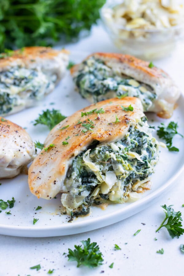 Spinach Artichoke Stuffed Chicken - Evolving Table