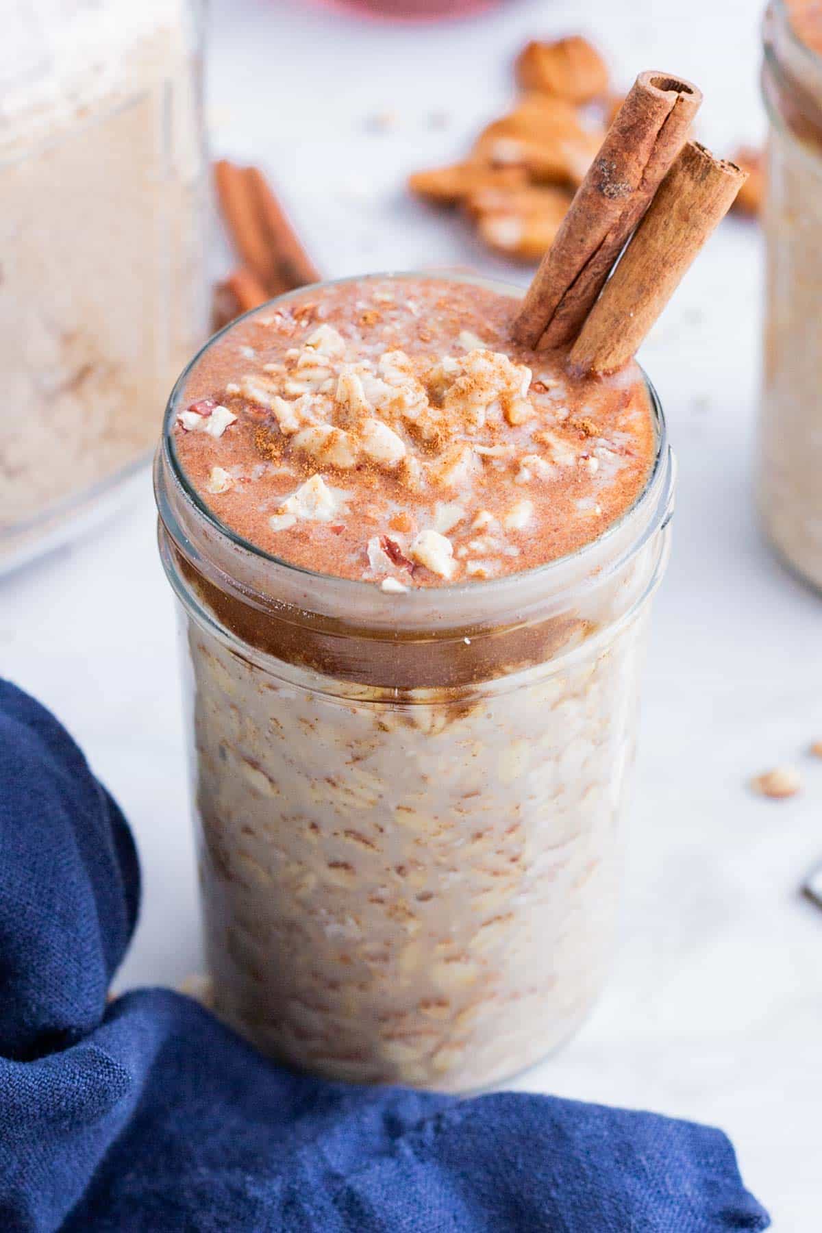 Cinnamon sticks are added to the jar with maple brown sugar oatmeal.