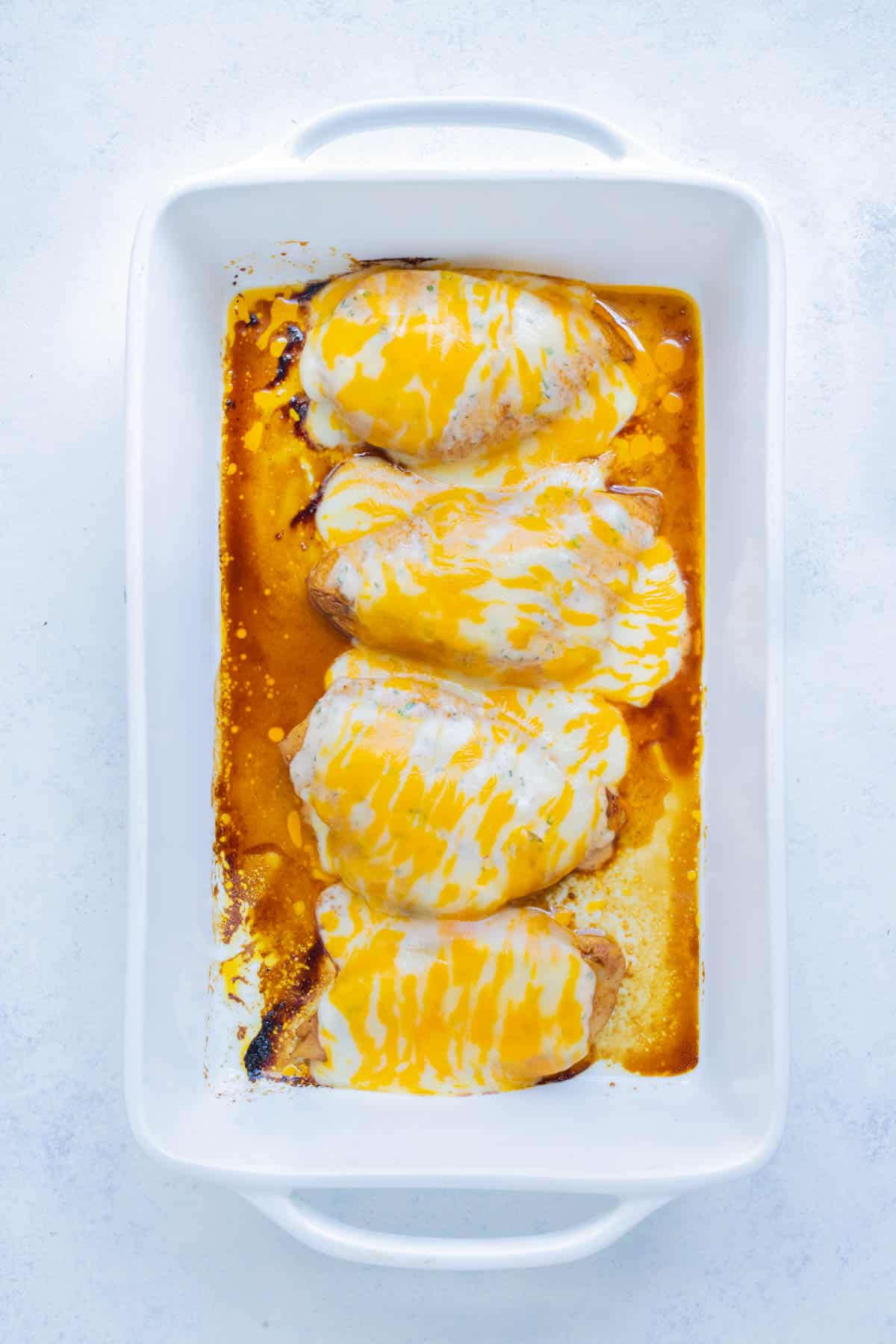 Fiesta lime chicken is baked in the oven until cheese is melted.