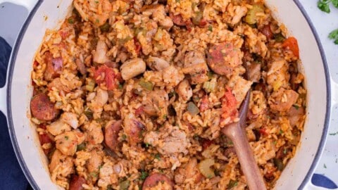 A Dutch oven full of a sausage Jambalaya recipe for a Cajun Mardi Gras party.