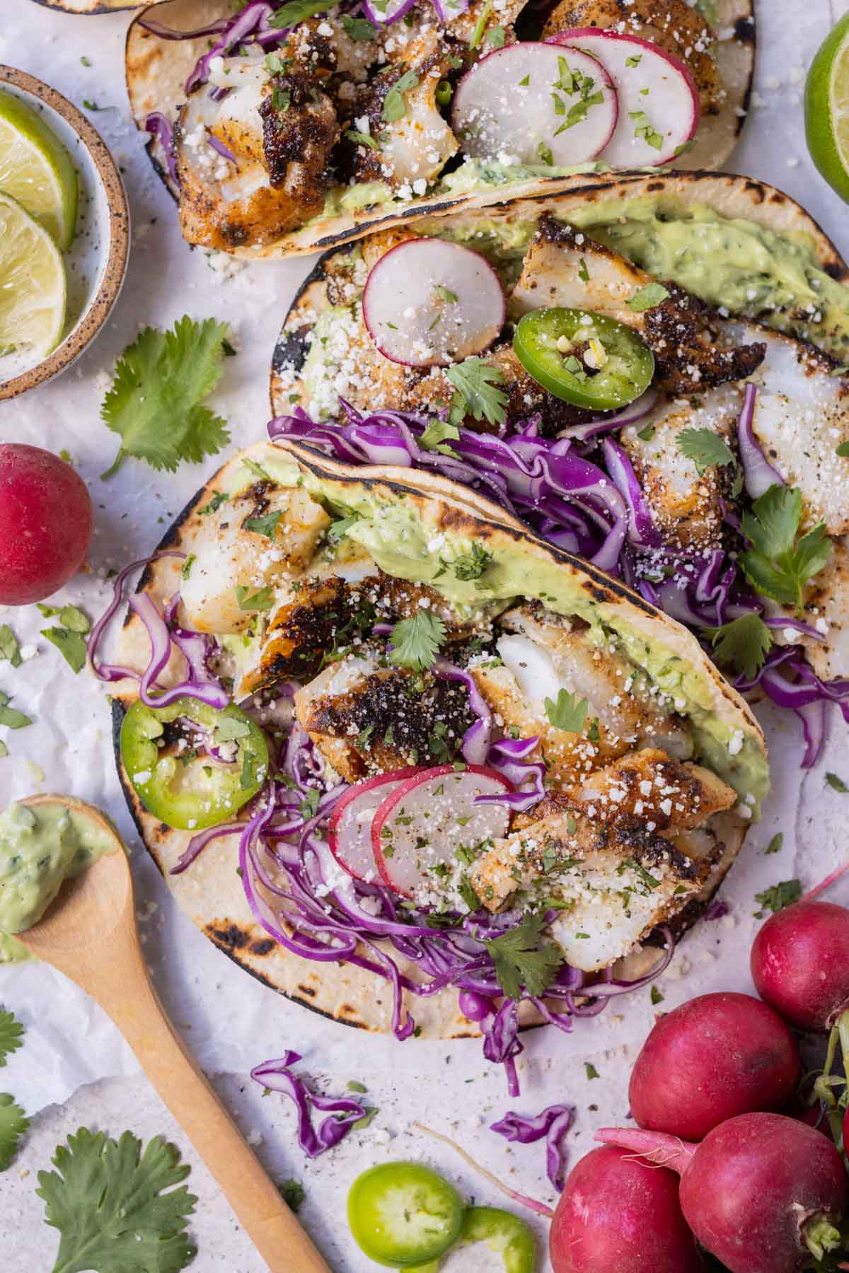 Blackened Fish Tacos with Avocado Sauce RECIPE served together in three tacos.