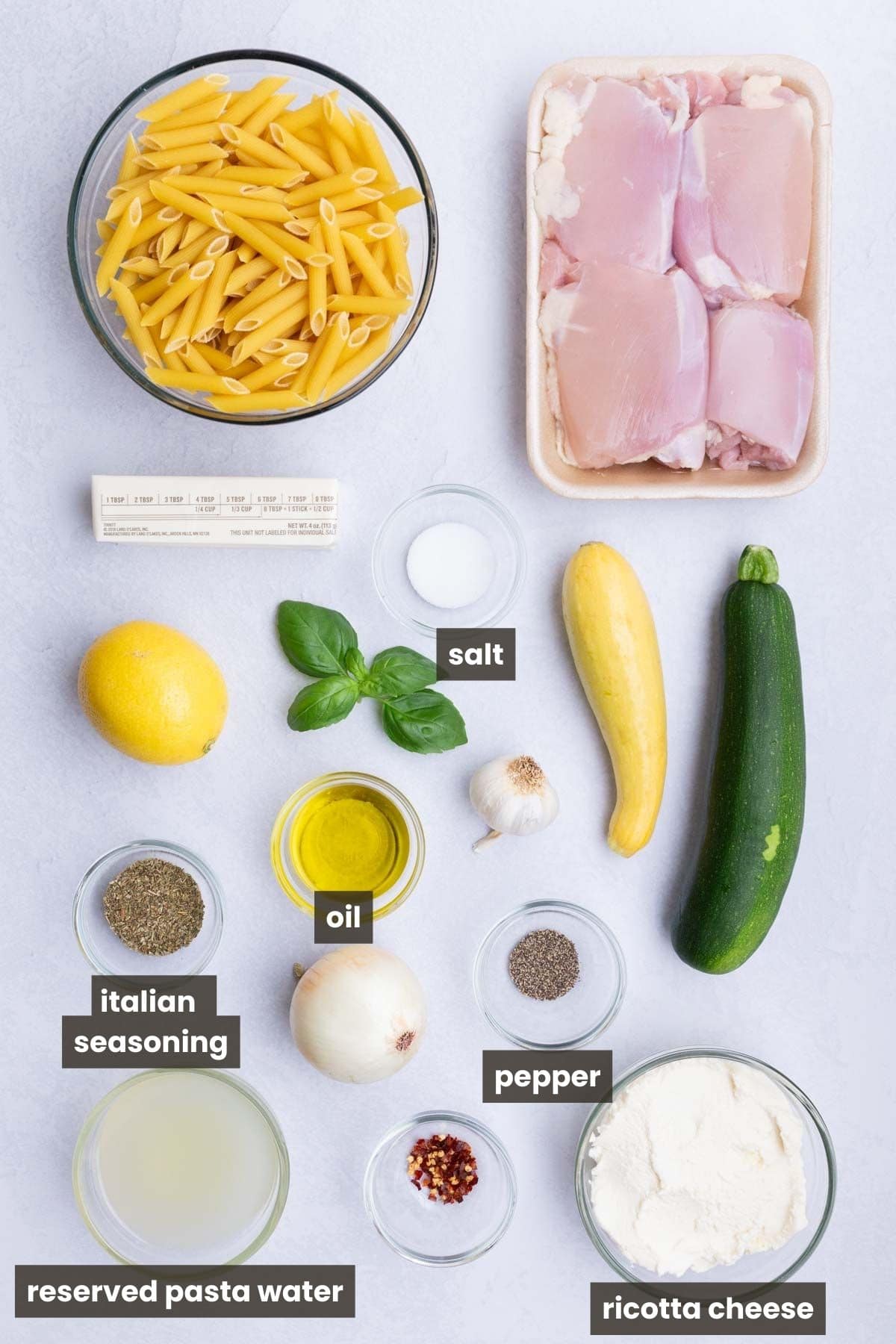 Chicken thighs, pasta, zucchini, squash, onion, lemon, and ricotta are the main ingredients for this dish.