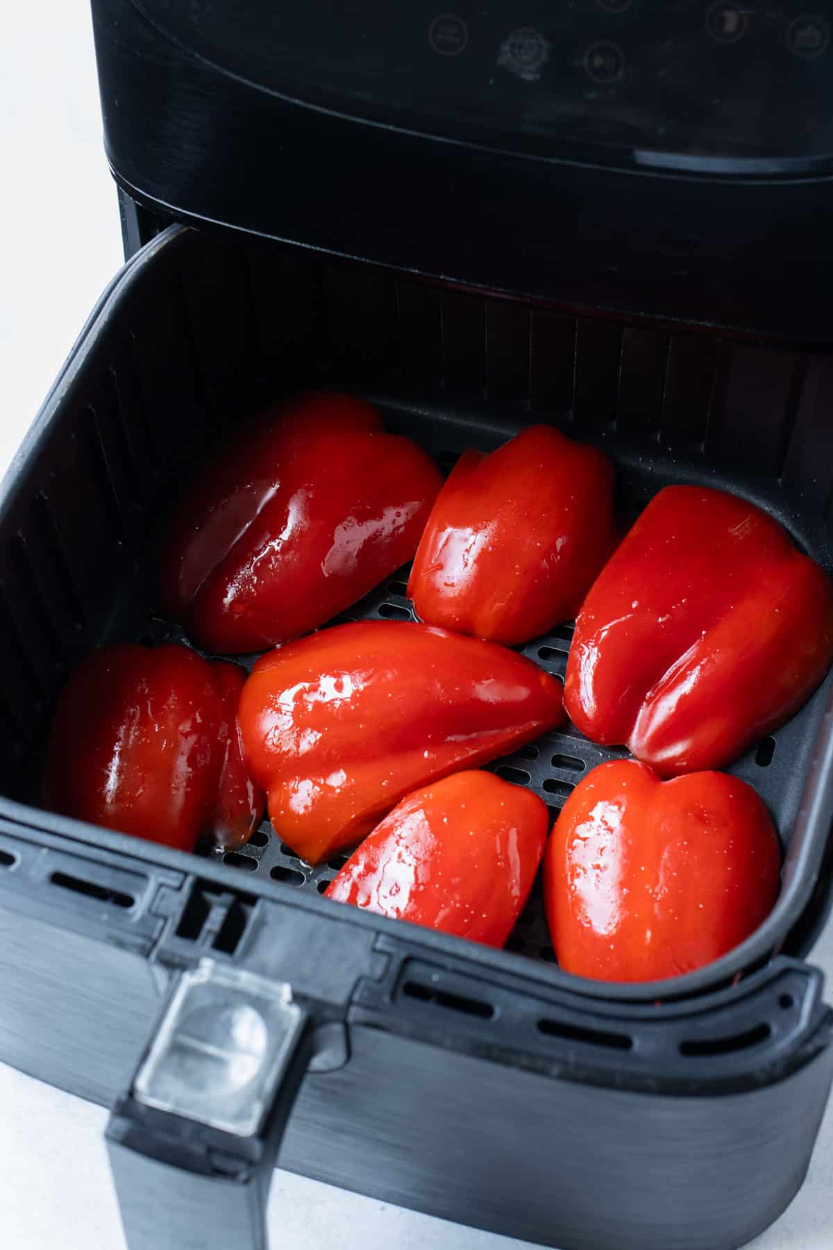 Bell peppers are roasted in an air fryer.