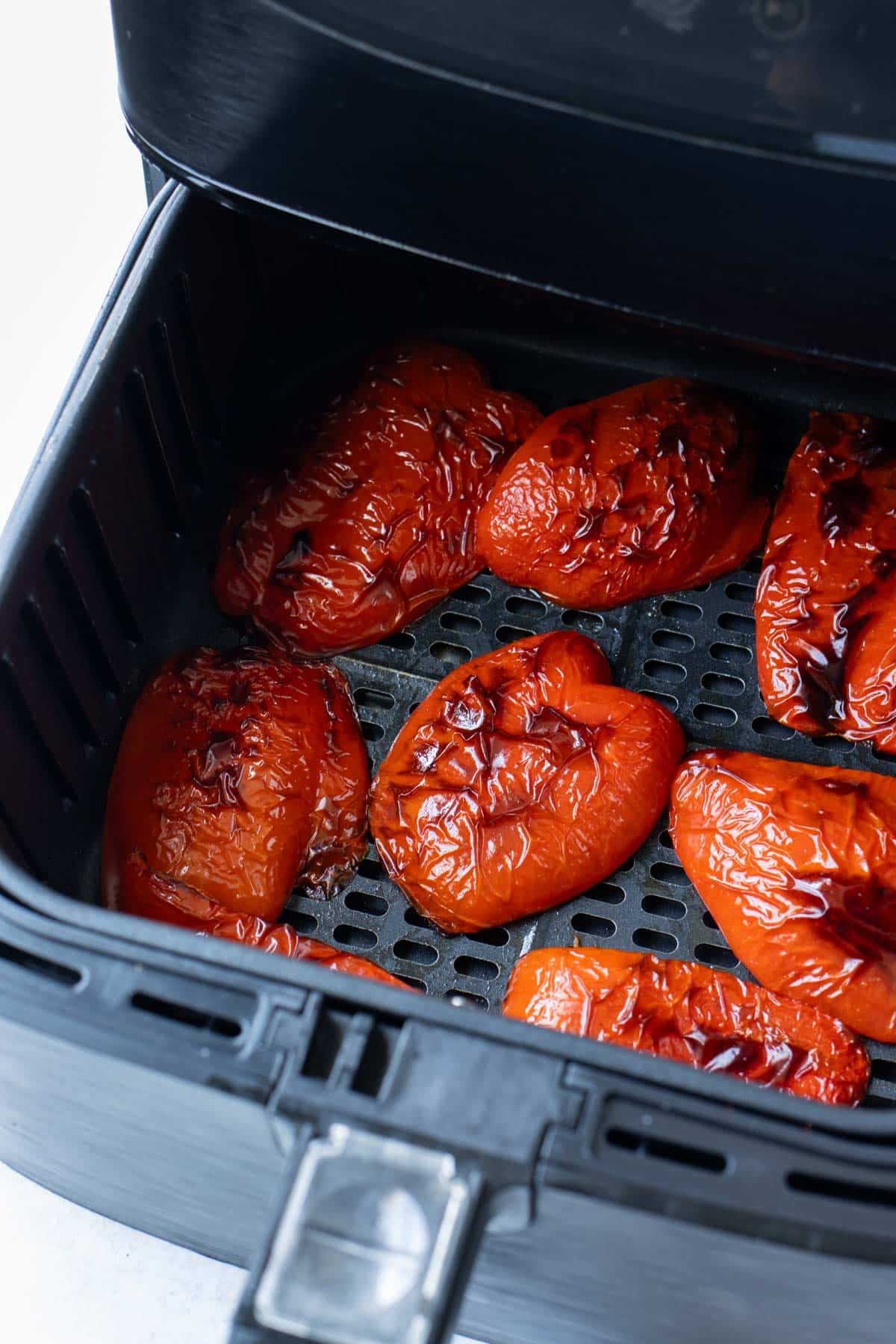 Bell peppers are roasted in an air fryer.