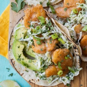 A plate full of Baja shrimp tacos are ready to serve.