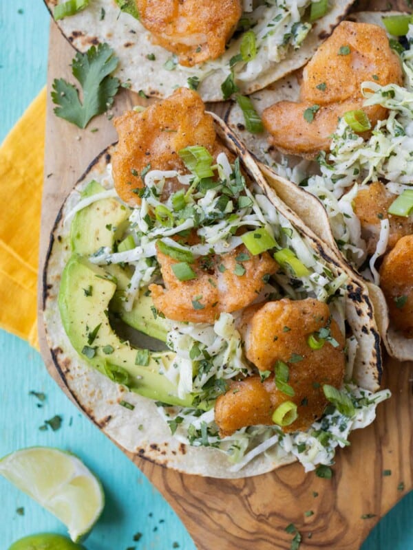 A plate full of Baja shrimp tacos are ready to serve.