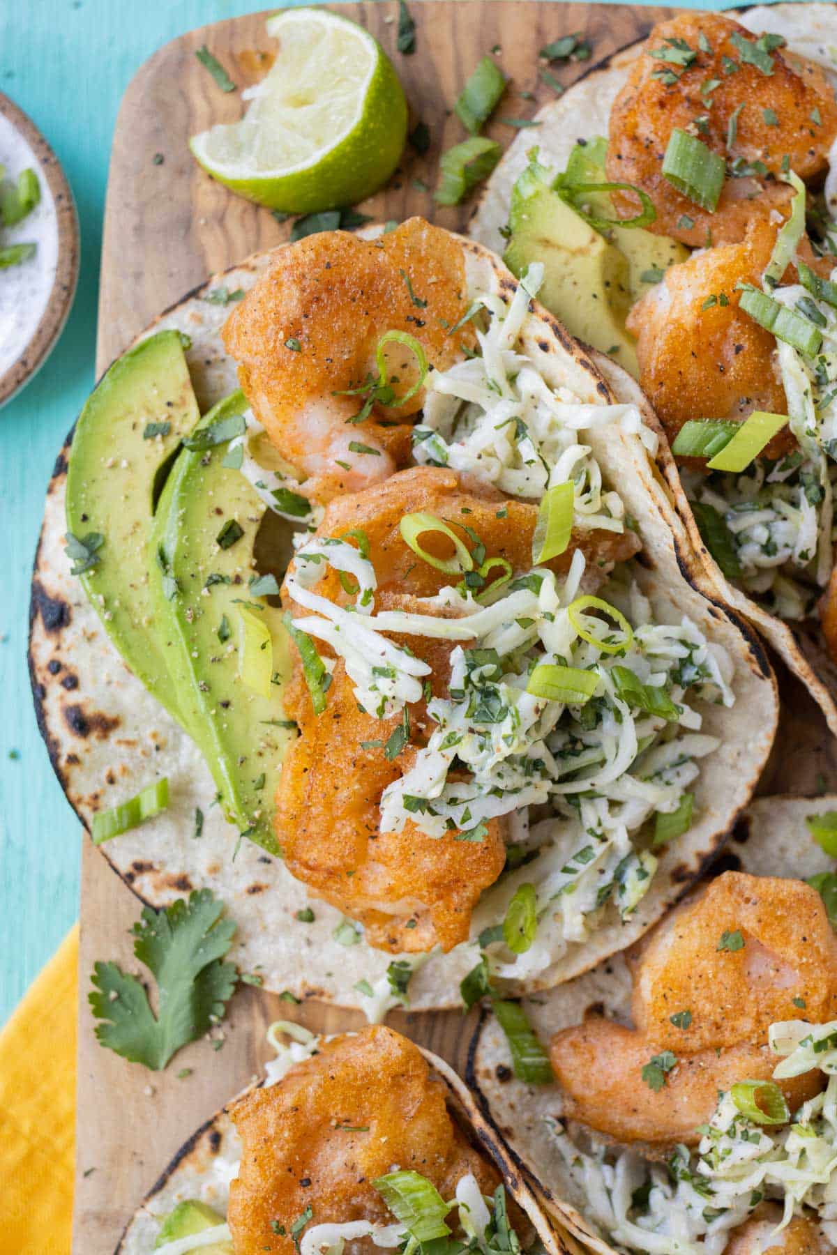 A plate full of Baja shrimp tacos are ready to serve.