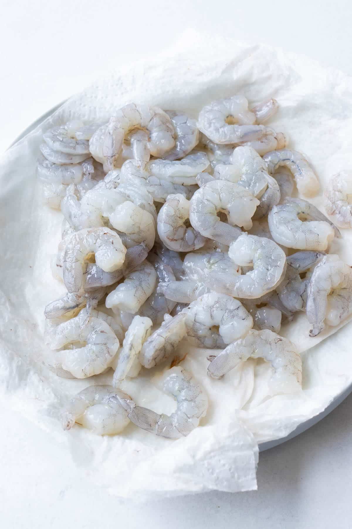 Shrimp is dried off before being added to the batter.