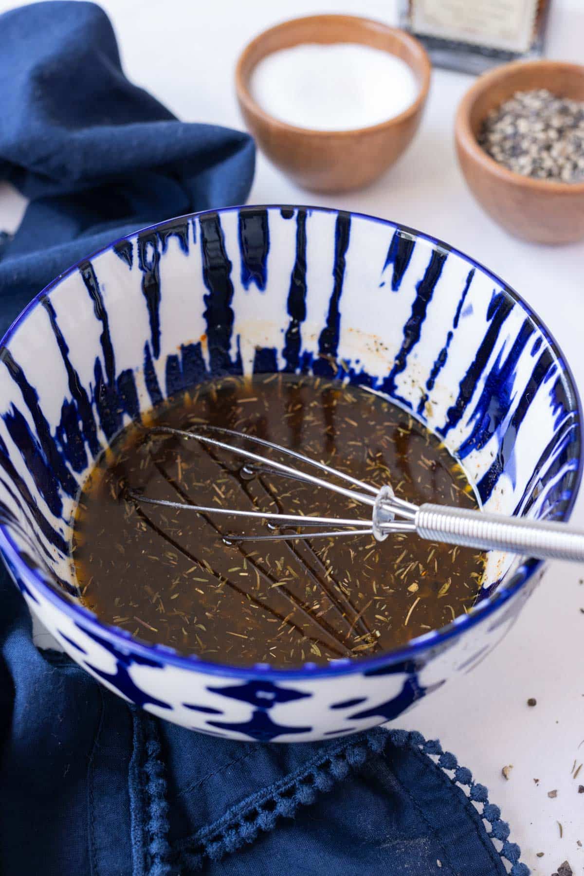 A balsamic marinade is whisked together.
