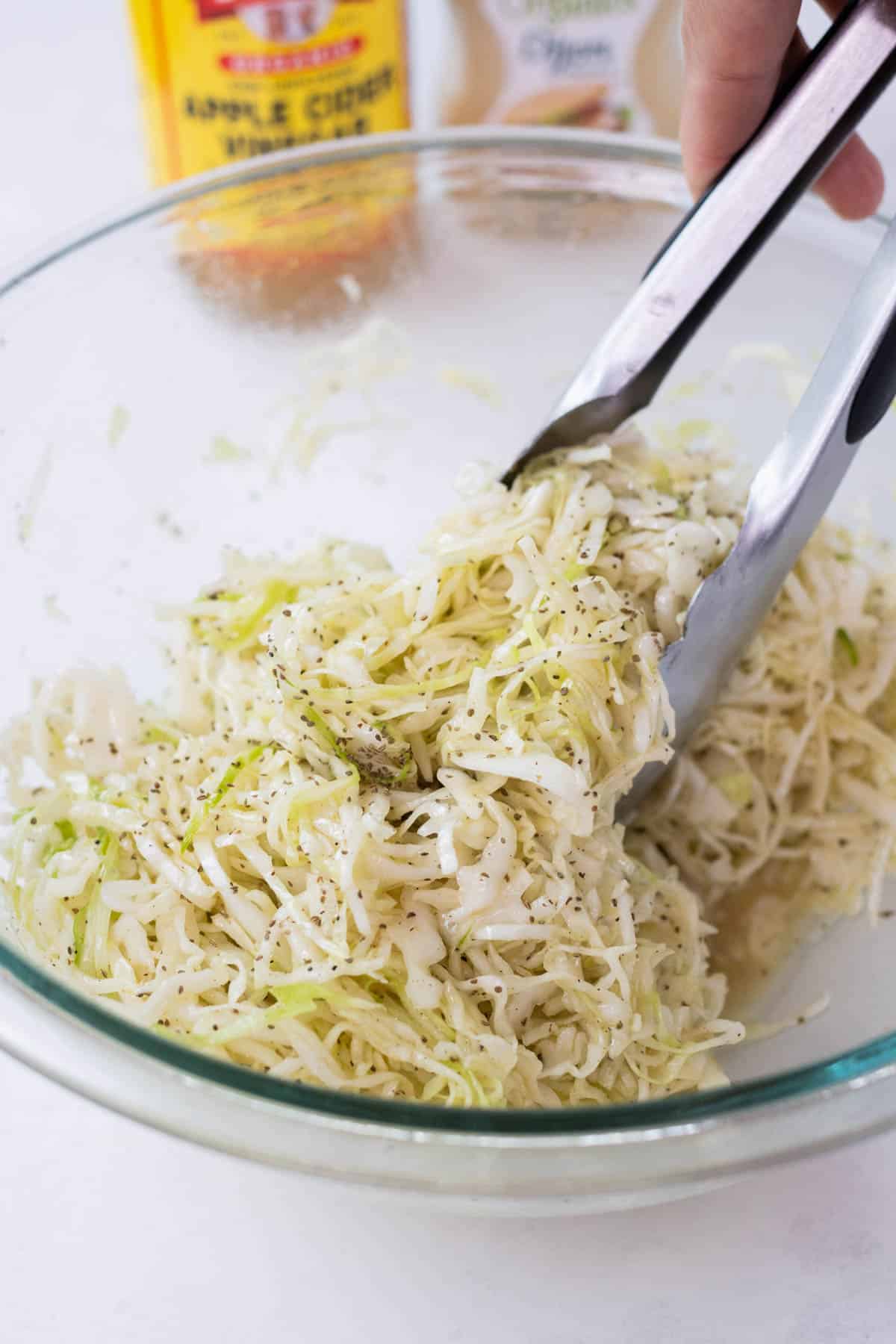 Shredded cabbage is tossed with the dressing.