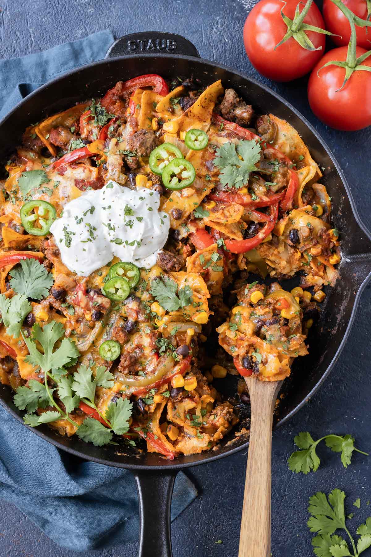 Ground Beef Taco Skillet (One-Pot Recipe) RECIPE served in a cast iron skillet with a wooden spoon.