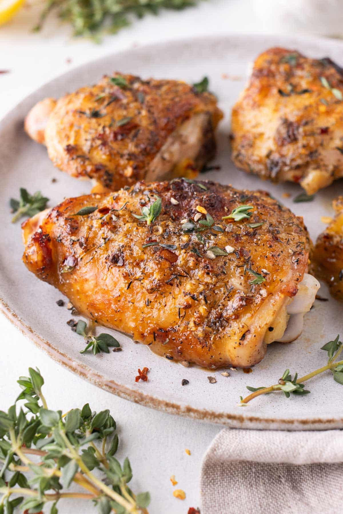 Baked Honey Mustard Chicken Thighs RECIPE served on a white plate.