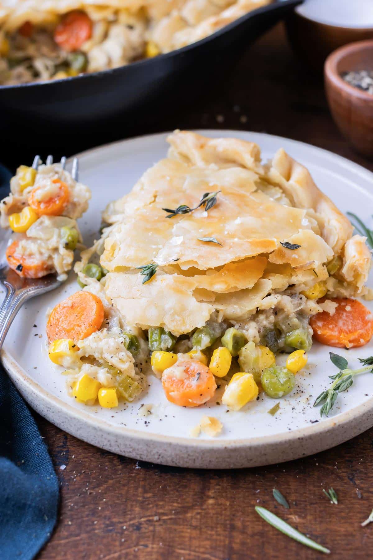 Skillet chicken pot pie is served on a white plate.