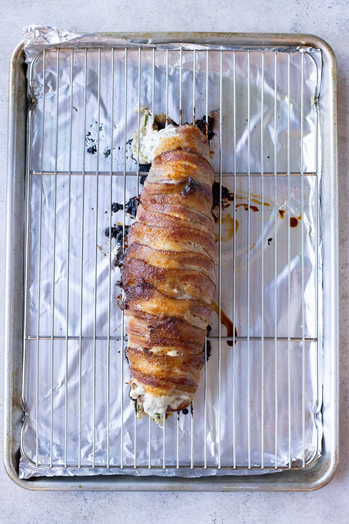 The wrapped pork is baked in the oven.