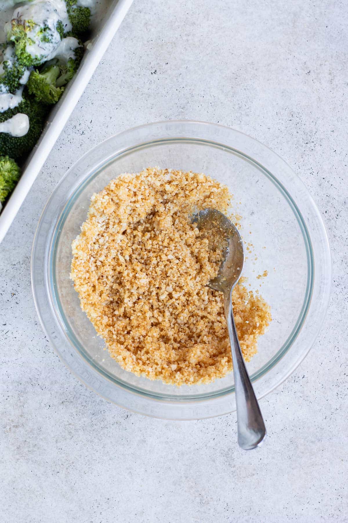 The topping is stirred together in a white bowl.