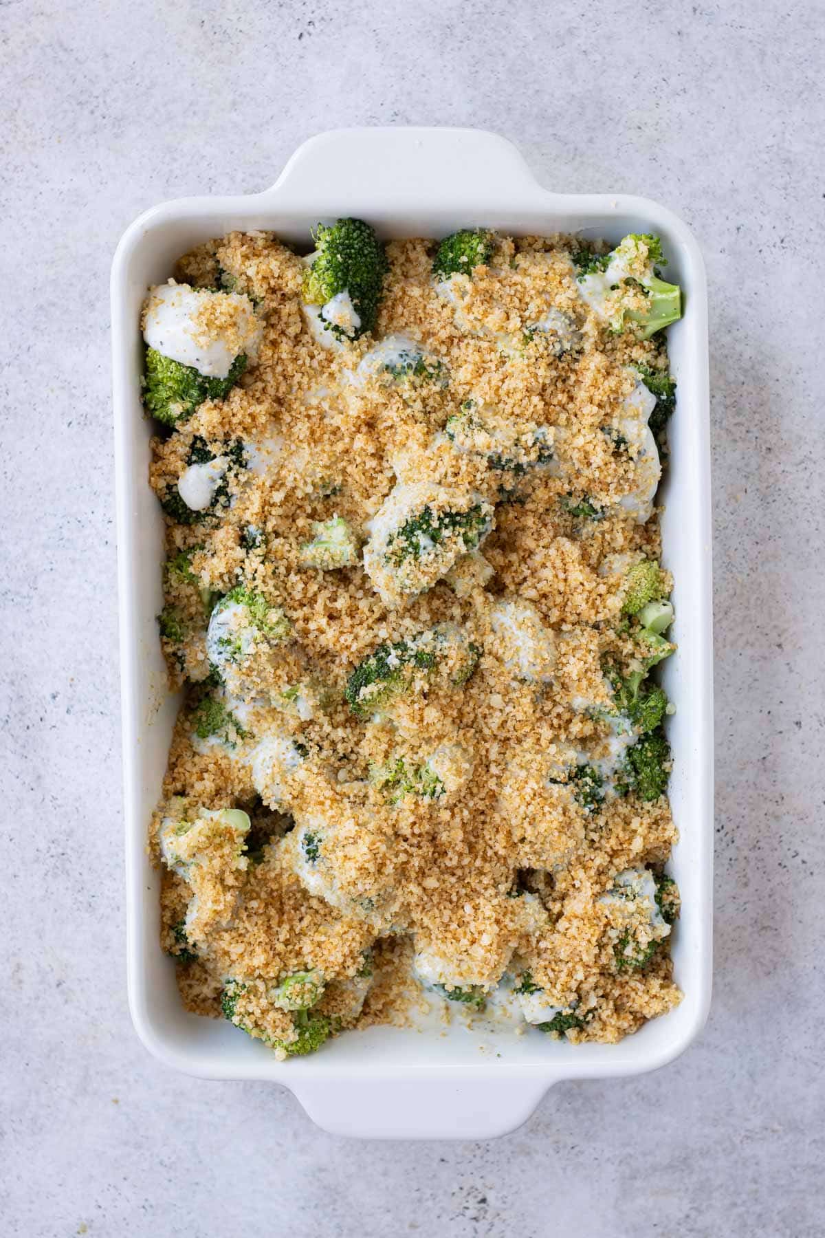 The breadcrumb topping is sprinkled over the broccoi.