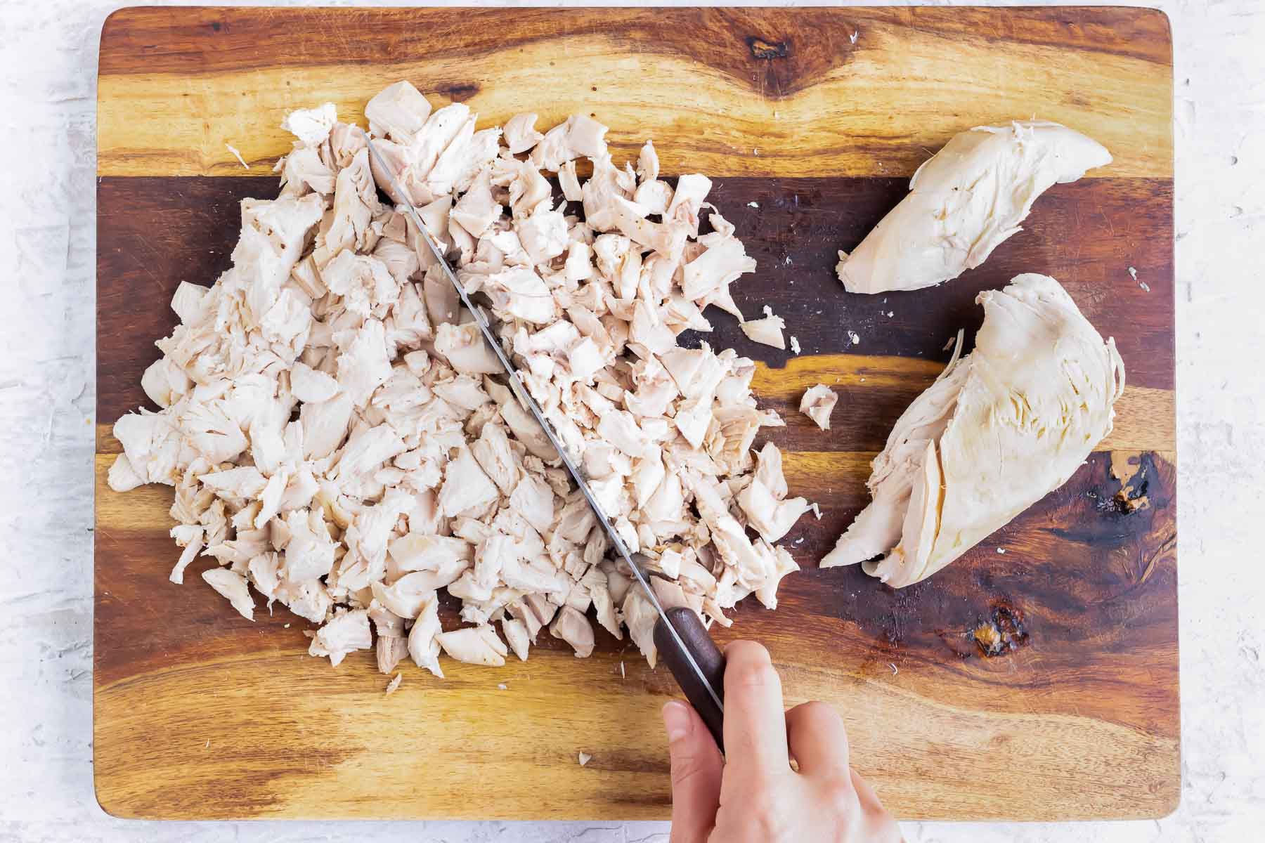 Cooked turkey is diced into small pieces.