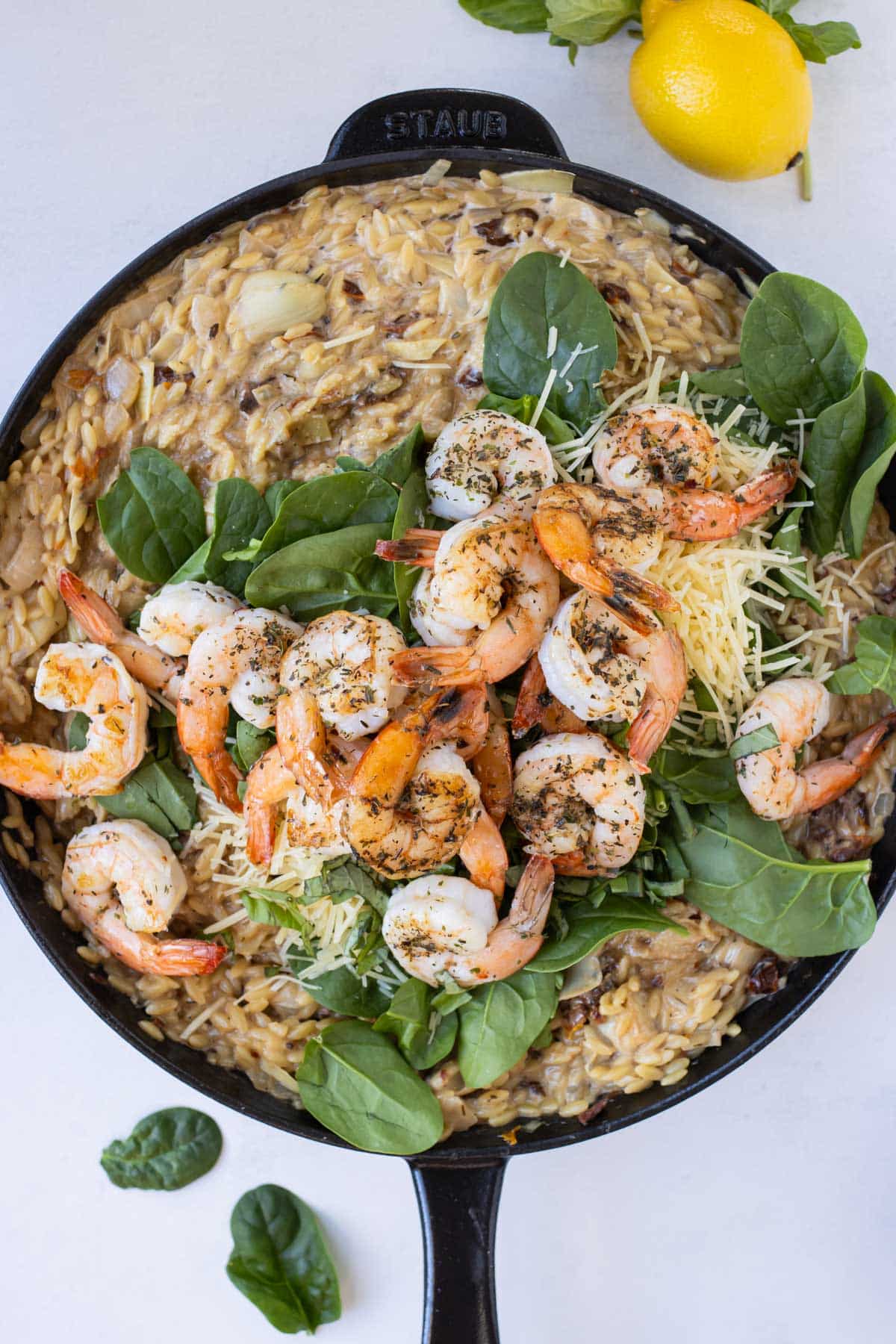 Cooked shrimp, spinach, and Parmesan are added to the orzo mixture.