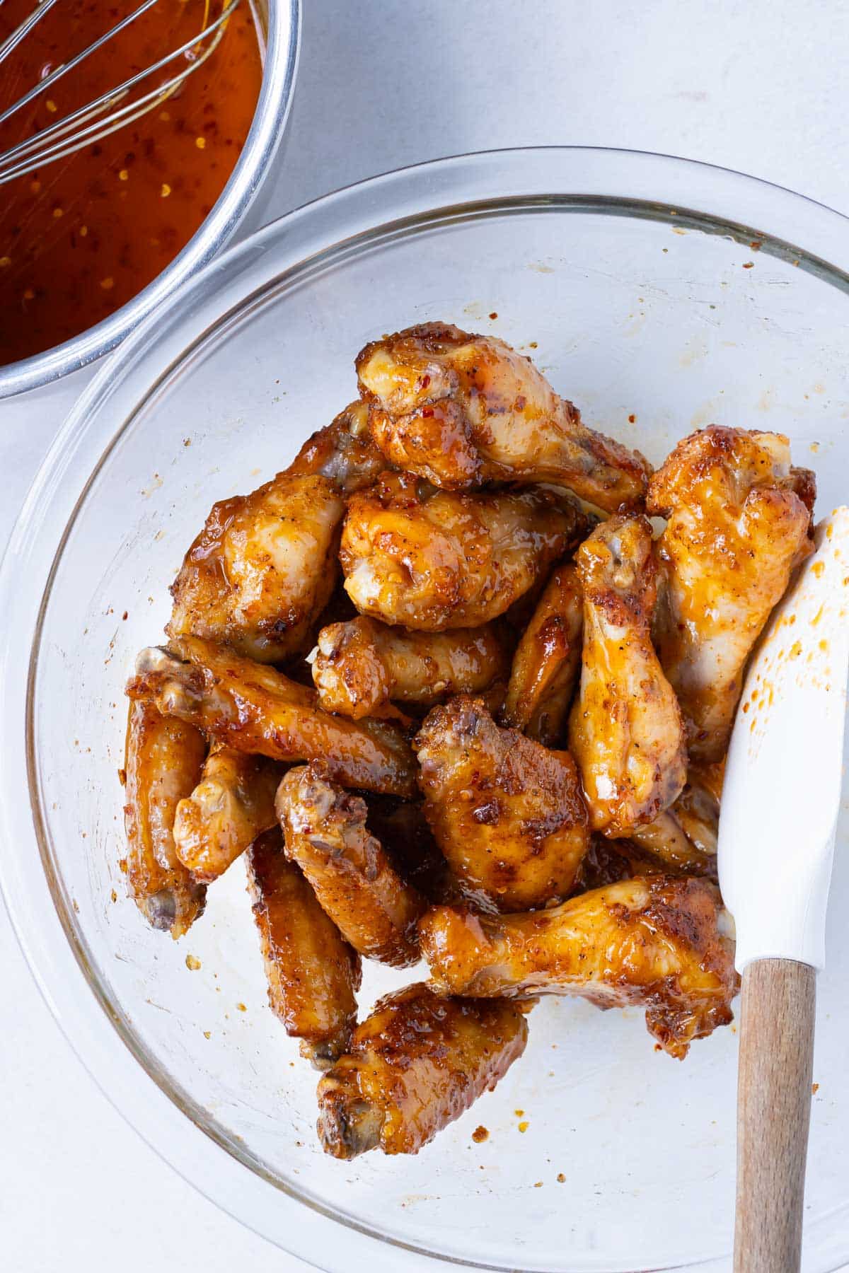 Baked wings are tossed in a hot honey sauce.