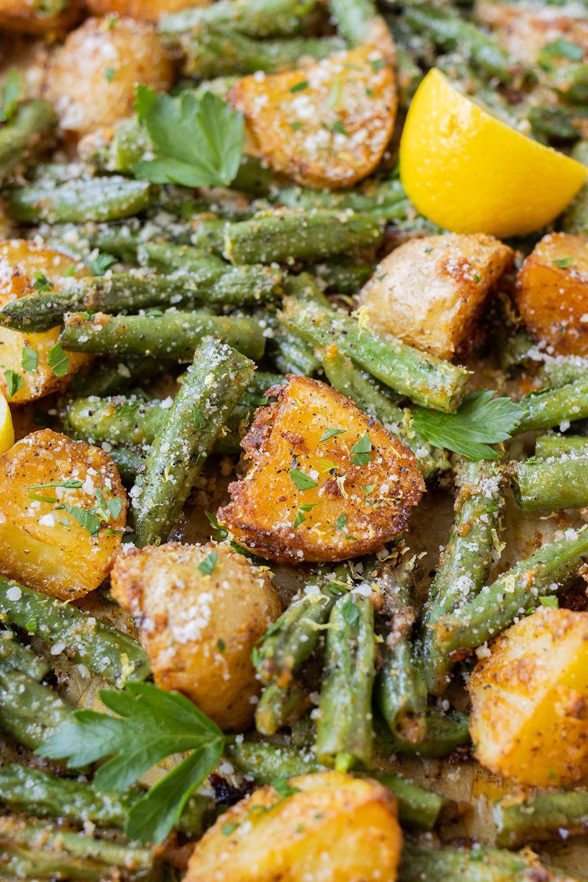 Green beans and potatoes are roasted in the oven.