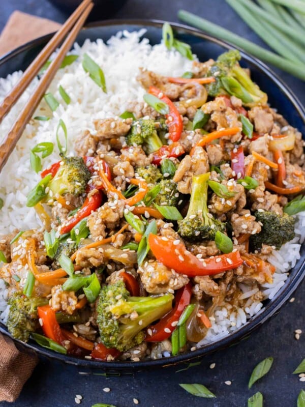 A ground turkey teriyaki rice bowl is served with chopsticks.